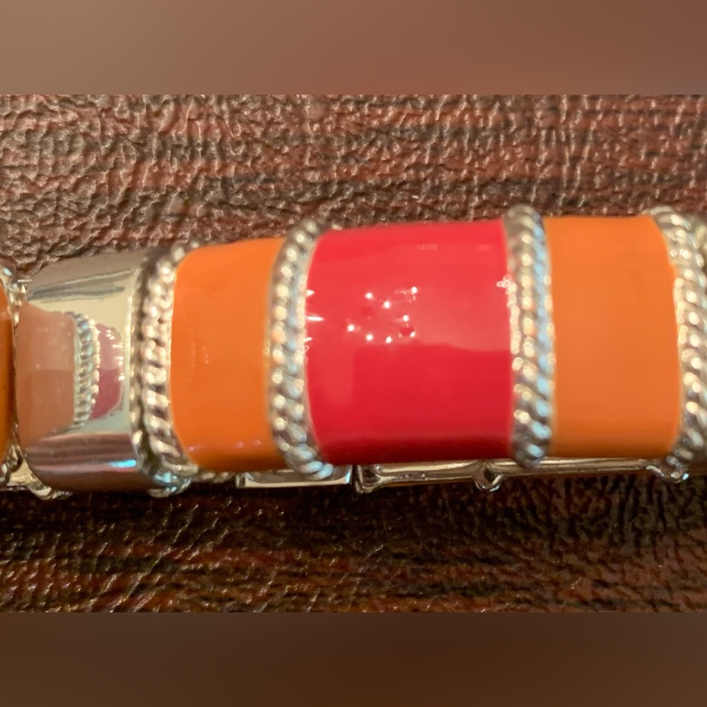 Bracelet, fuscia/orange/silver; expands/ stretches over wrist;